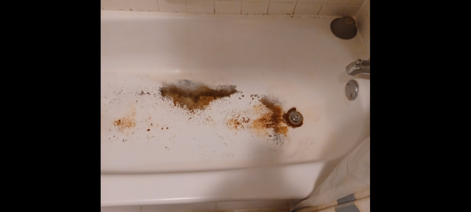 Rust was reversed, then a rust inhibitor was applied after a polyester filler filled in low spots and damaged areas. Before the bathtub could be refinished by Dallas bathtub refinishing services.